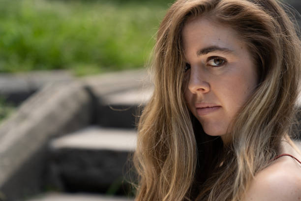 istock Girl looking at camera in Central park 1167871082