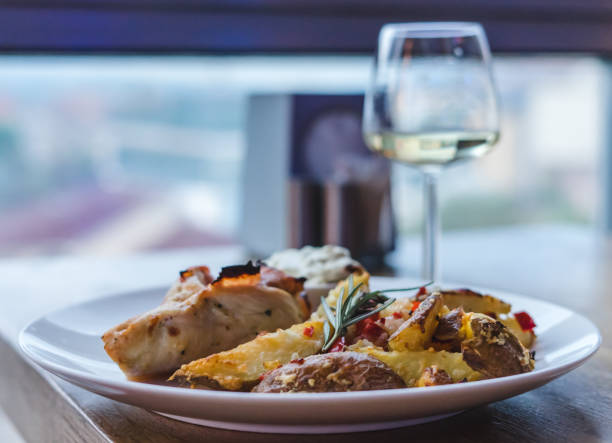 istock Restaurant meal, chicken meat with potatoes and white wine 1167871941