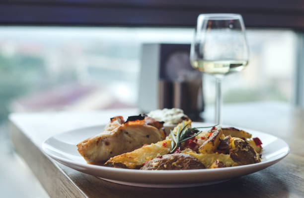 istock Restaurant meal, chicken meat with potatoes and white wine 1167871969