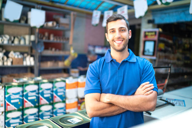 Portrait of a young sales man standing in a paint store Portrait of a young sales man standing in a paint store pardo brazilian photos stock pictures, royalty-free photos & images