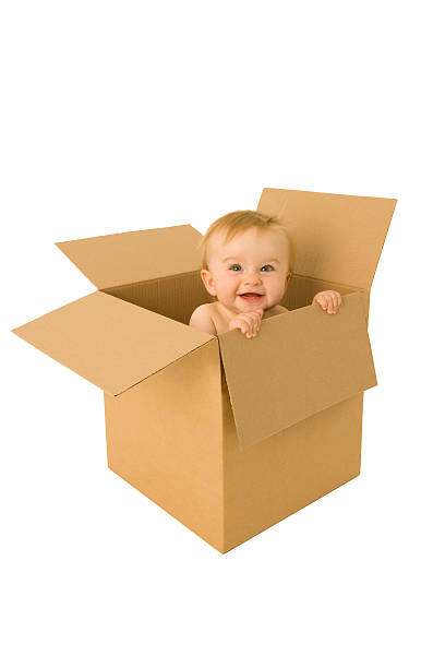 Baby emerges from a cardboard box