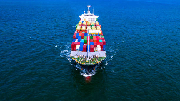 istock Container cargo ship carrying container for business freight import and export, Aerial view container ship arriving in commercial port. 1167877445