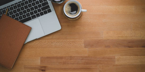 istock Contemporary workplace with laptop computer and coffee cup 1167882188