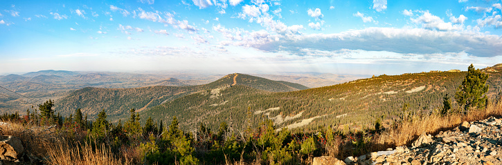 Panoramic view of autumn mountains and blue sky: view from the top. Sheregesh, Russia.