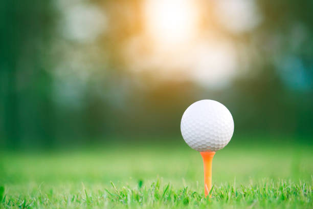 istock golf ball on tee in a beautiful golf course 1167884217