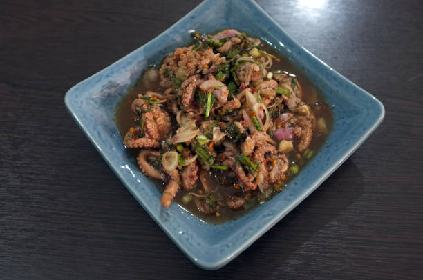 istock Thai cuisine , spicy minced squid salad . 1167888801