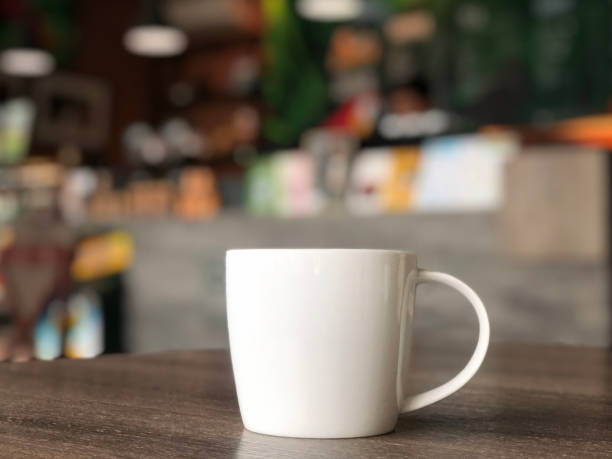 istock white coffee mug on the table in the cafe shop 1167892307