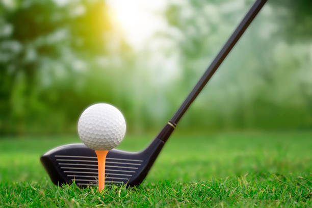 istock Golf clubs and golf balls on a green lawn 1167894141