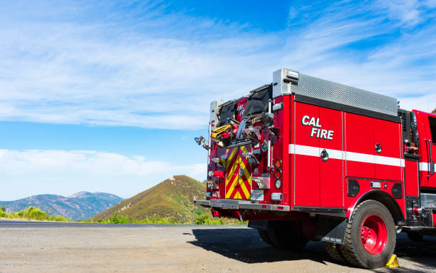 CAL FIRE engine truck parked outdoors on mountain road stock photo