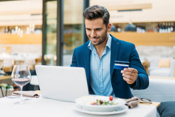 istock Businessman dining in restaurant and using credit card 1167900010