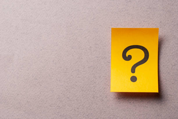 istock Colorful yellow card with printed question mark 1167902032