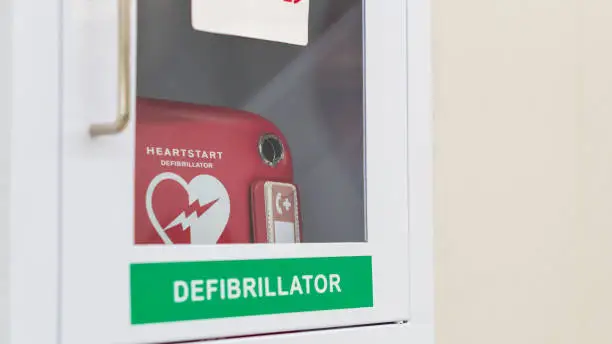 Heart defibrillator service box or AED in the public location for emergency case, automated external CPR tool in airport