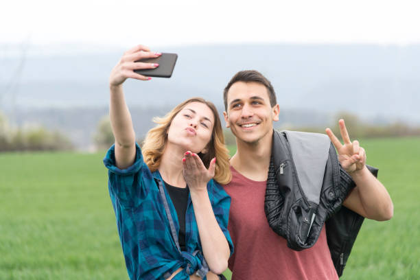 istock Couple walking in field and have fun. 1167903119
