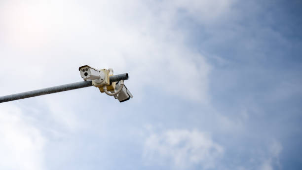 istock modern CCTV security camera and video Installed on the road inside the community 1167904765