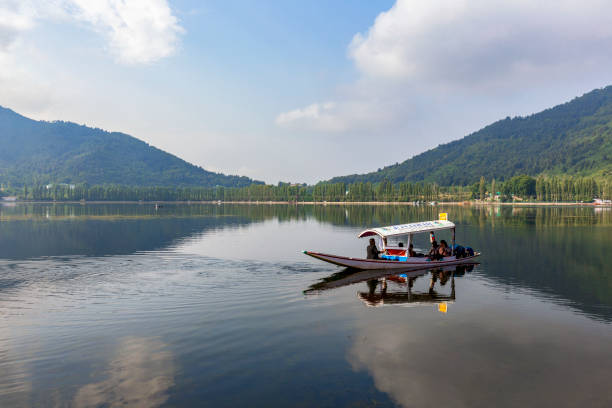 Scenic view of Dal lake, Jammu & Kashmir, India unidentified tourists enjoying boating at Dal Lake, Sri Nagar, Jammu & Kashmir, India on June 23, 2018 lake nagin stock pictures, royalty-free photos & images