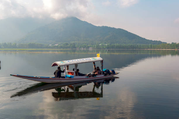 Scenic view of Dal lake, Jammu & Kashmir, India unidentified tourists enjoying boating at Dal Lake, Sri Nagar, Jammu & Kashmir, India on June 23, 2018 lake nagin stock pictures, royalty-free photos & images