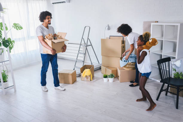 istock Family Unpacking and Cleaning. Move into New Home. 1167907129