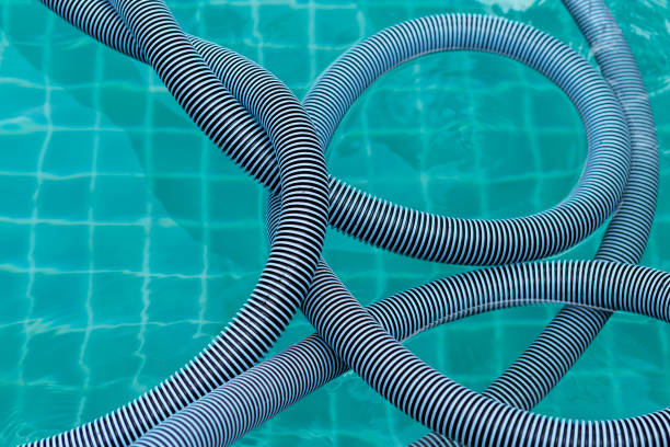 istock Swimming Pool Vacuum Hose floating on the swimming pool 1167909210