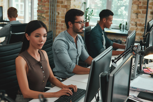 Daily Routine Group Of Young Employees Working On Computers While ...