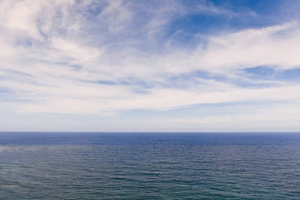 istock Seascape by day. Calm sea and sky with clouds 1167910043