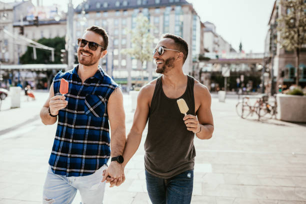 istock Freedom for LGBT couples - holding hands in public 1167910296