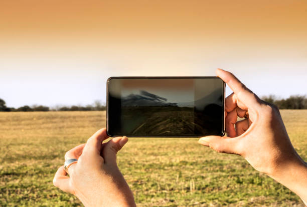 istock Taking a photo in agricultural field. Technology concept 1167910780