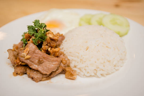 istock Pork fried garlic with rice and fried egg, Thai food 1167911395