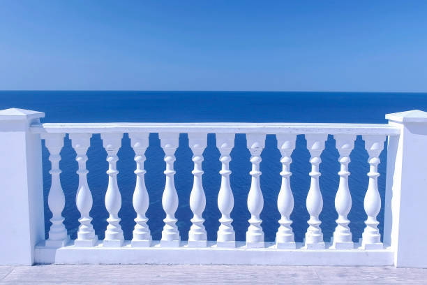 istock Classic white terrace with decorative fence and sea view om waterfront. 1167911462