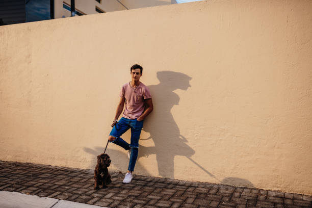 istock Latino guy with dog - lots of copy space 1167912566