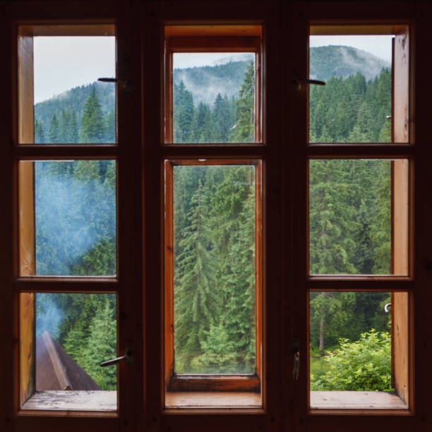 istock Wooden window with mountain forest view. 1167919744