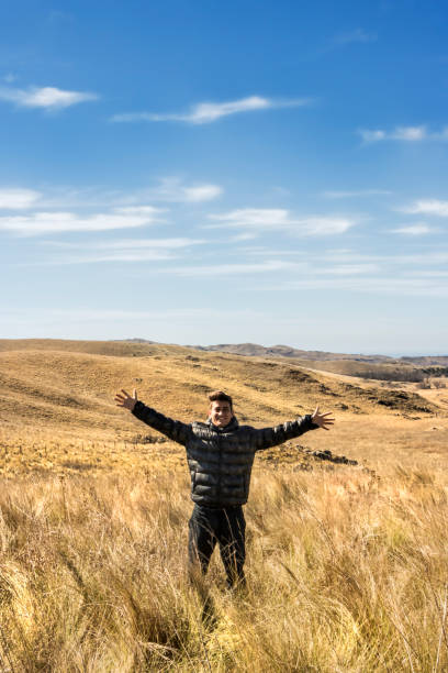istock Happy young man enjoying nature. Freedom concept. 1167922355
