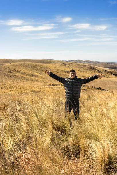 istock Happy young man enjoying nature. Freedom concept. 1167922879