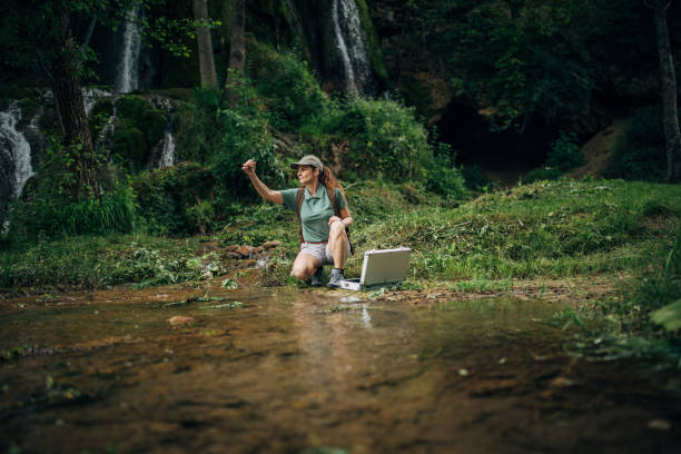 istock Lady biologist taking a water sample in nature 1167922997