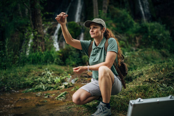 istock Biologist taking a water sample in nature 1167923010