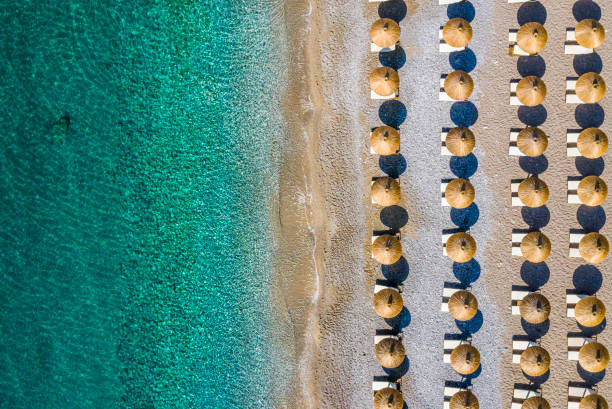 istock Beach coastline dotted with umbrellas 1167927288