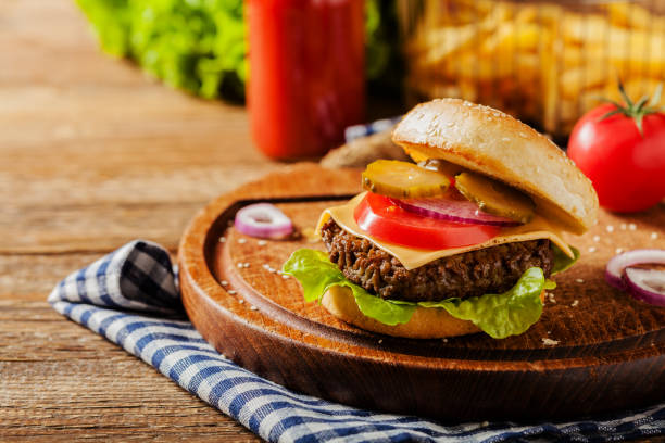 istock Homemade, beef hamburger with cheese and vegetables. 1167931899