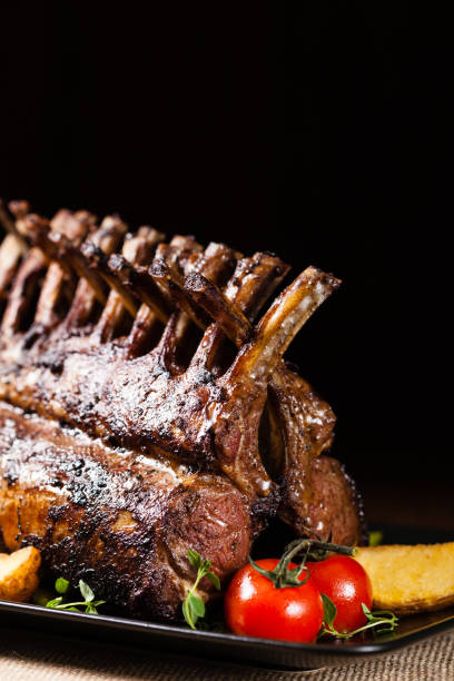 istock Baked lamb loin, served with asparagus. 1167933971