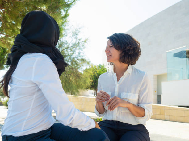 istock Multicultural female coworkers chatting outside 1167934172
