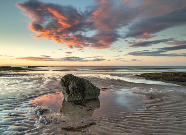 istock Sunset over Bamburgh beach in Northumberland. 1167935437