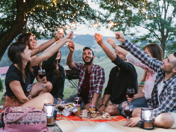 istock Happy friends having fun together with sparklers 1167937095