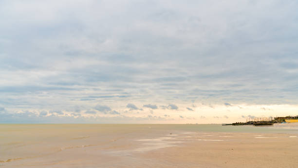 istock yellow sand by the sea 1167937506