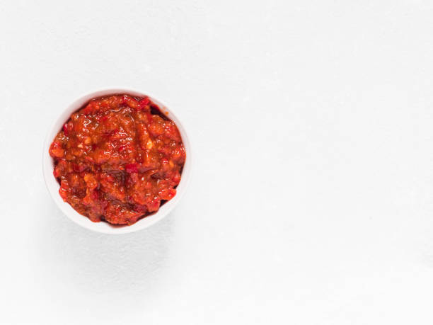Gochujang. Traditional Korean soybean paste with sticky rice and fermented soybeans, dressed with red pepper in high concentration in a white bowl