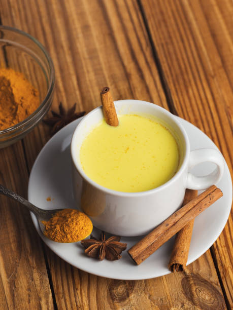 istock Golden milk with turmeric on wooden table 1167939405