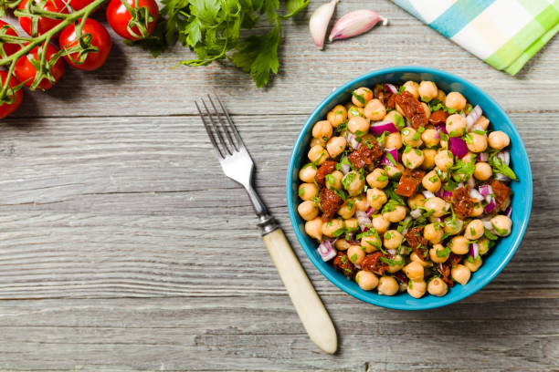 istock Chickpeas salad with onion and dried tomatoes. 1167939549