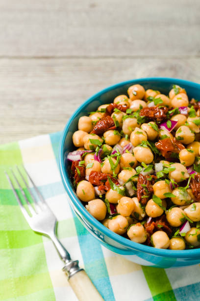 istock Chickpeas salad with onion and dried tomatoes. 1167941255