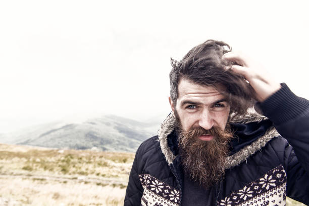 istock bearded handsome serious man on mountain top 1167943187