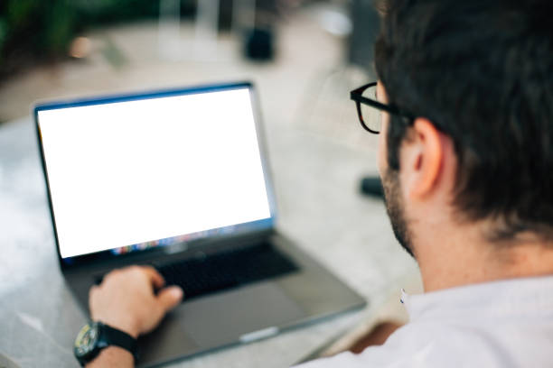men using laptop with blank screen stock photo