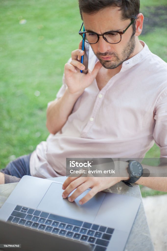 Male Computer Programmer Working On Laptop Stock Photo - Download Image ...