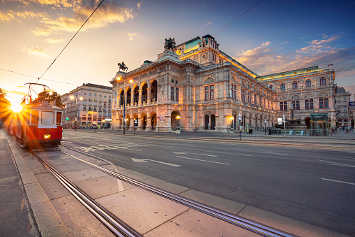 Cityscape image of Vienna with the Vienna State Opera during sunset.