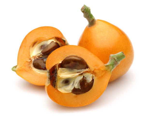 istock Half and whole ripe loquat fruits isolated on white 1167946270